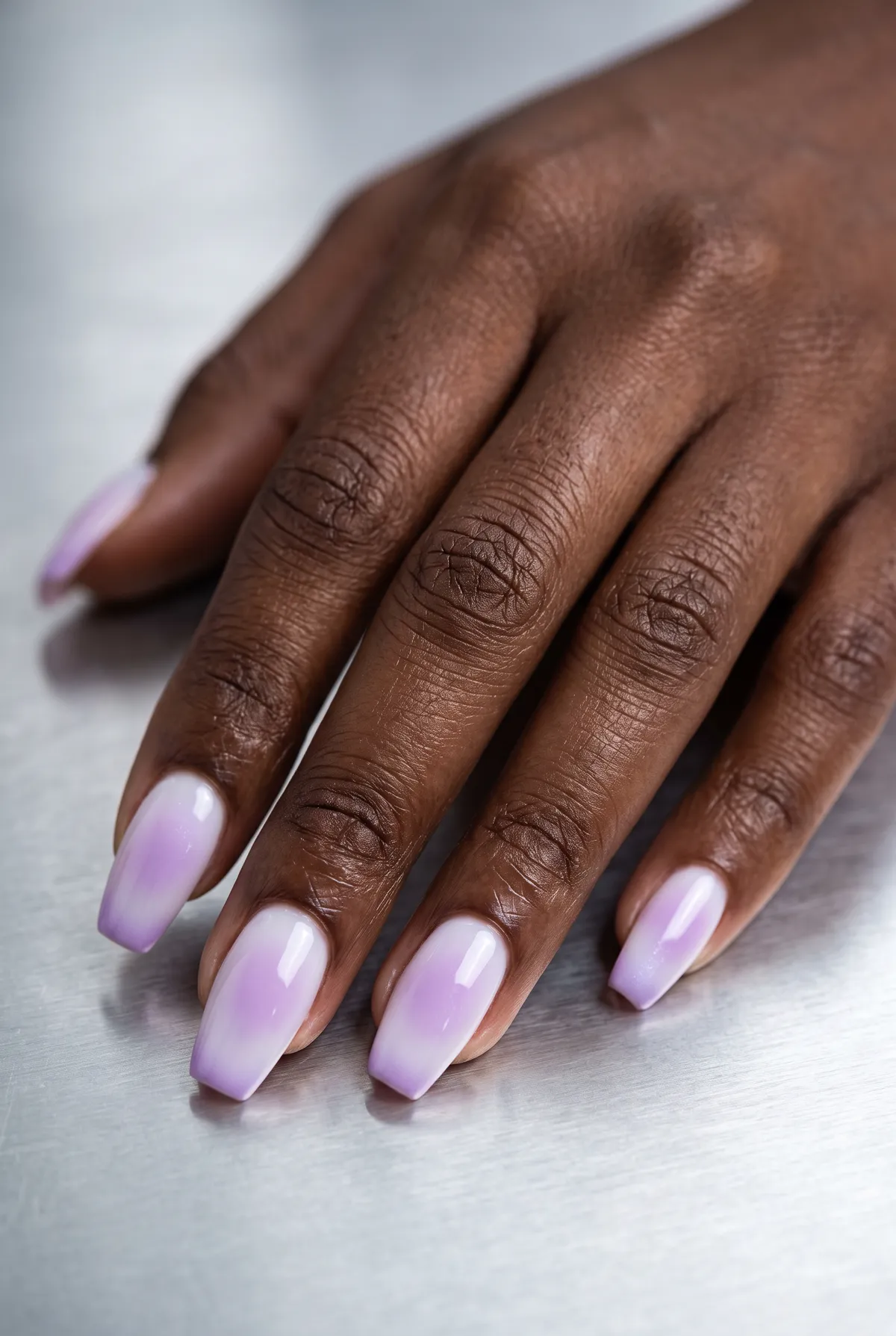 Lilac Mist Aura — coffin nails with soft lilac aura effect airbrushed over a milky white base on a medium coffin shape