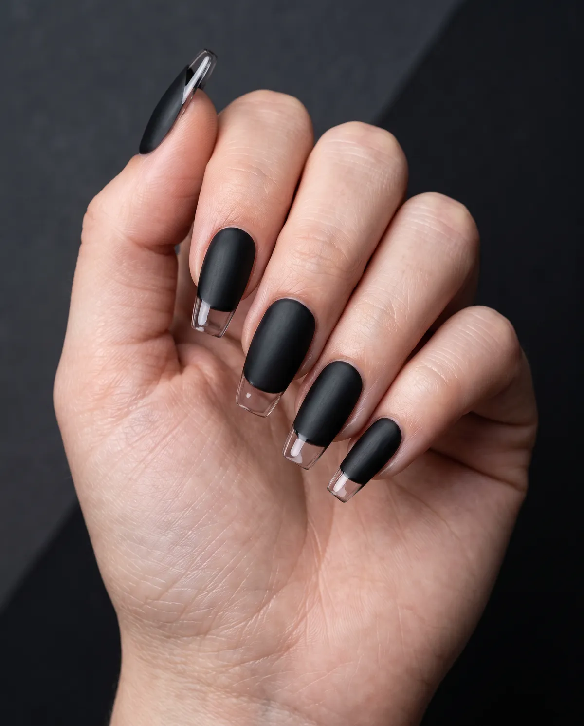 Onyx Glass Tip — coffin nails with matte black gel base with a glossy clear tip on a medium coffin shape