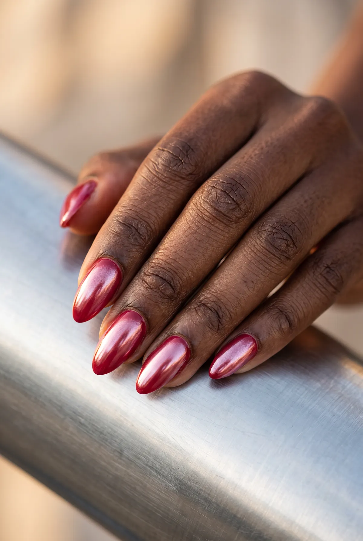 Glazed Cranberry — almond fall nails with cranberry base with a pearl chrome glaze buffed over the top, glossy seal, almond shape