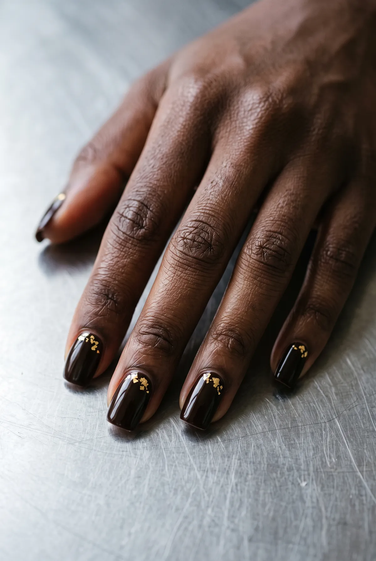 Gold-Flecked Espresso — square fall nails with deep espresso crème with small gold foil flakes near the cuticle on each nail, high gloss