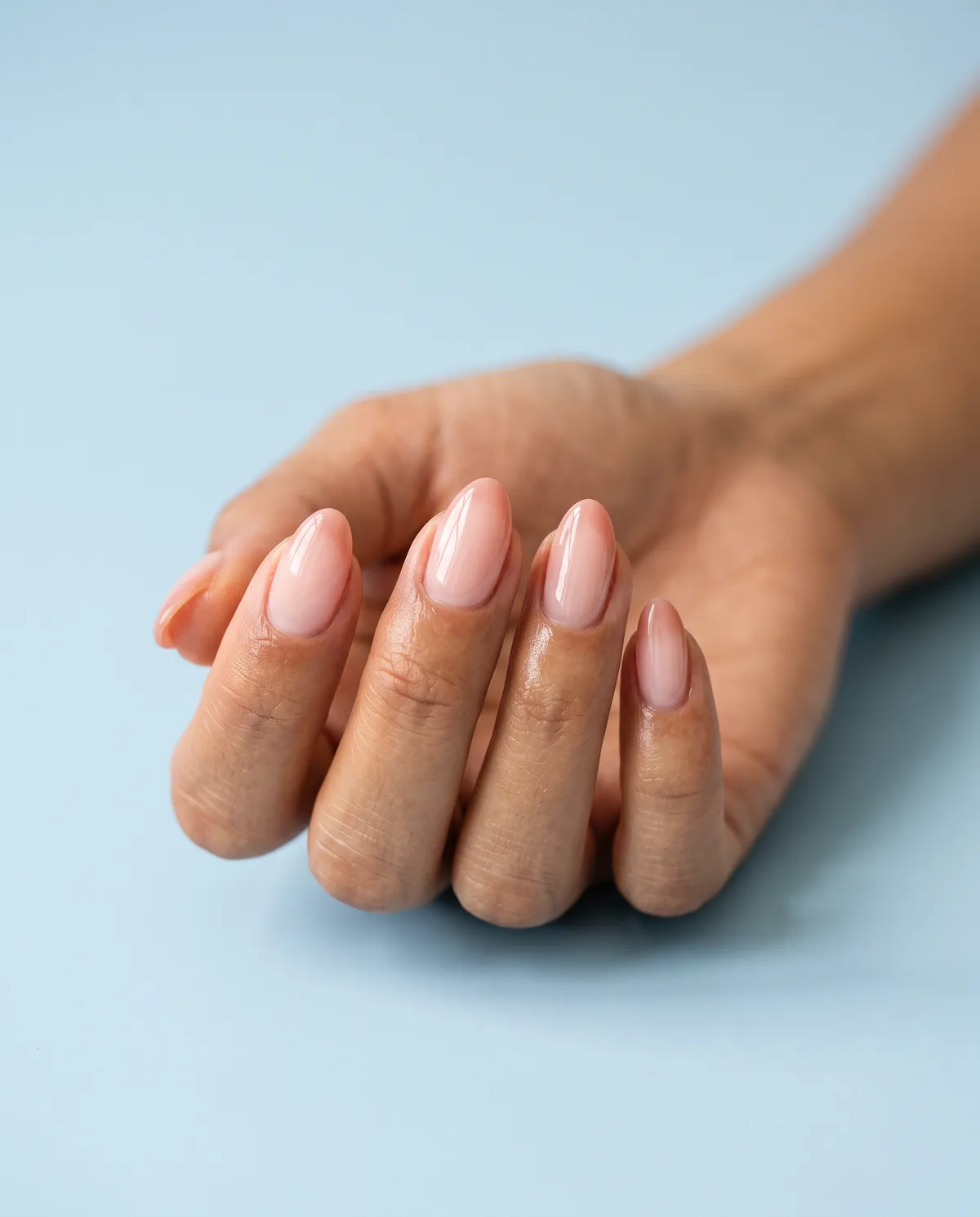 Soft Aura Blush — almond short almond nails with soft aura nails: blush-pink airbrushed center fading to a sheer edge, short almond