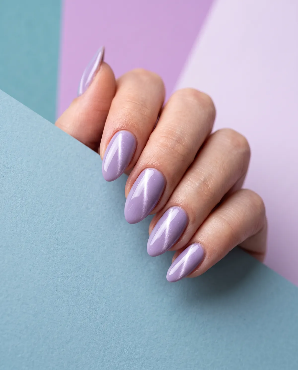 Icy Lilac Cat-Eye — almond winter nails with almond shape, apply lilac cat-eye gel polish, use magnet tool to pull a vertical light line…